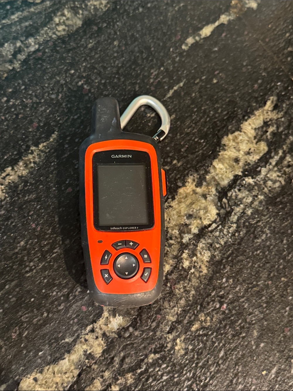 Garmin handheld GPS in bright orange with black trim